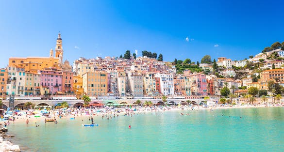 Menton, mediterranean sea on côte d'azur in France, historic architecture near turistic beach