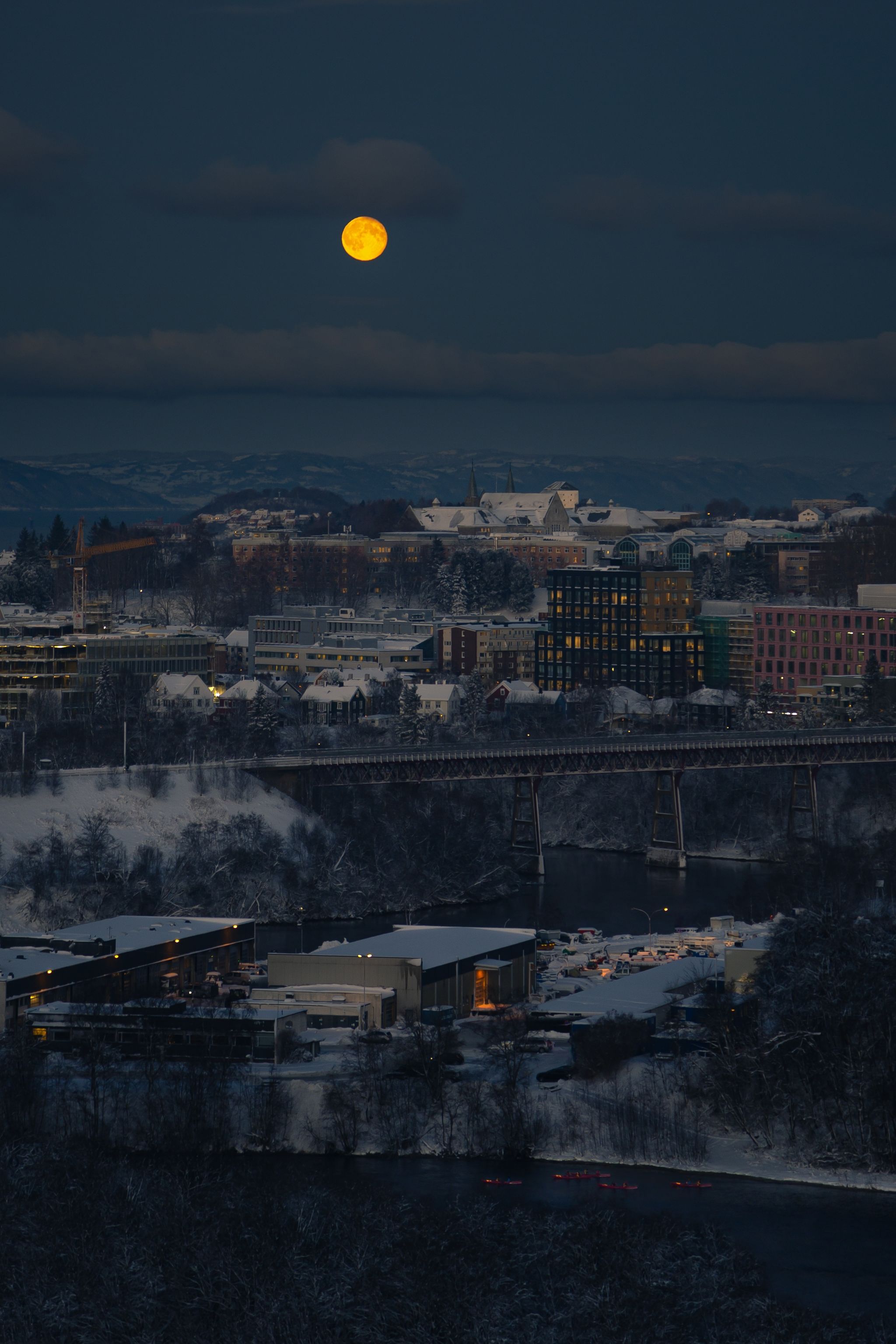 Winter in Trondheim big orange moon, dark winter