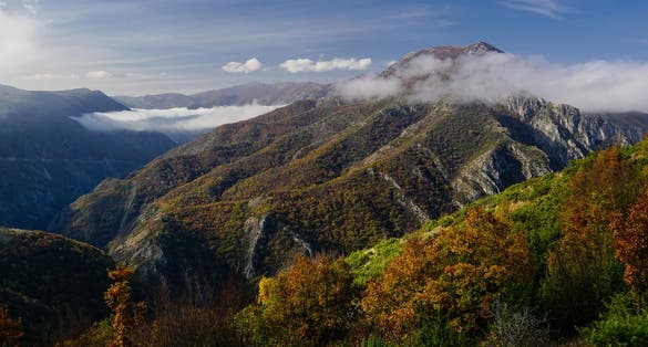 Photo of view from Vodno mountain towards Matka canyon and the Suva mountain peaks in North Macedonia.