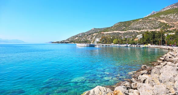 Photo of beautiful landscape with beautiful beach and blue sky of Loutraki Corinthia Greece, famous summer destination.