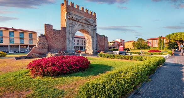 photo oof view of Spectacular morning view of Arch of Augustus. Splendid summer cityscape of Rimini town, Italy, Europe. Traveling concept background.