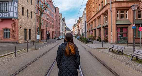 Photo of Tourist walking through the streets of Frankfurt, Germany. Historical city.
