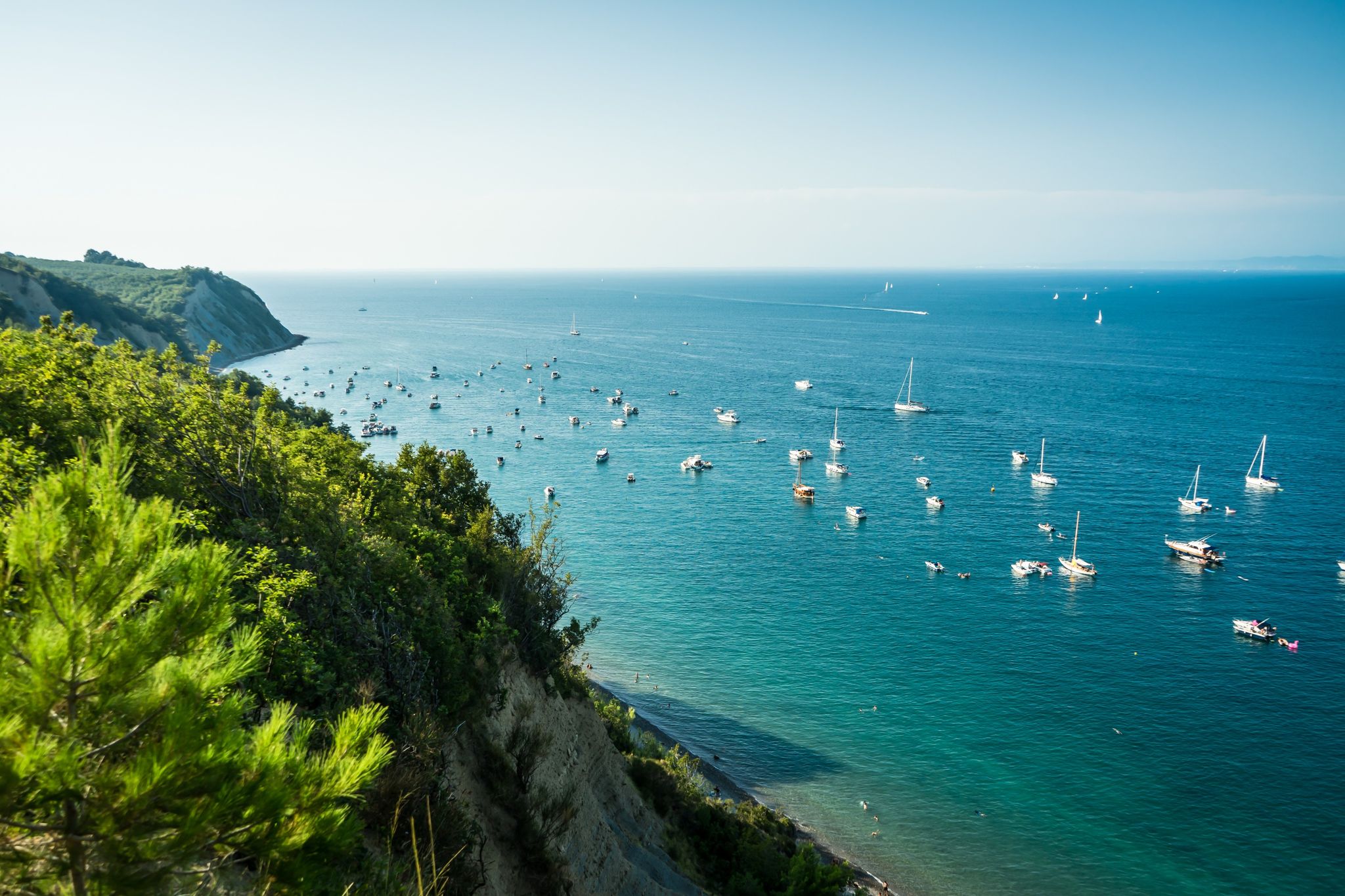Photo of View of Bele Skale beach in Slovenia, Sailing boats near the moon bay.