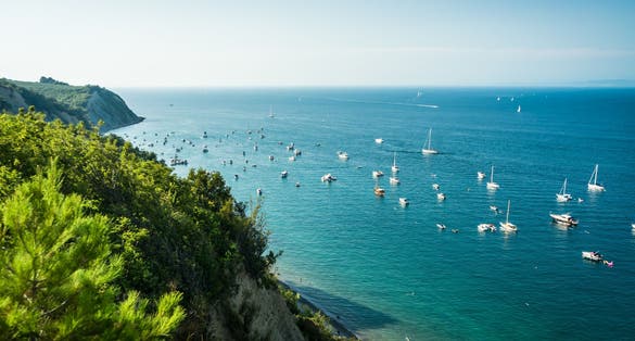 Photo of View of Bele Skale beach in Slovenia, Sailing boats near the moon bay.