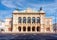 Photo of Vienna State Opera house in Austria on a sunny day.