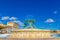 Photo of the famous Triton fountain, three bronze Tritons holding up a huge basin, in front of the City Gate in Valletta.