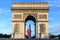 Photo of Arc de Triomphe  Early in the morning with the French flag, France.