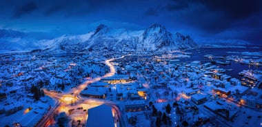 Photo of houses, bridge and panorama of Norwegian city Tromso beyond the Arctic circle from mountain in Norwegian fjords.