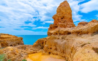 Photo of Carvoeiro fishing village with beautiful beach and colourful houses, Portugal.