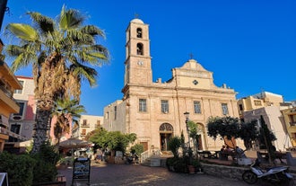 Photo of aerial view of Chania with the amazing lighthouse, mosque, venetian shipyards, Crete, Greece.