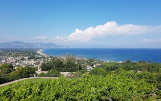 Photo of Umbrellas and sunbeds in San Felice Circeo, Italy.