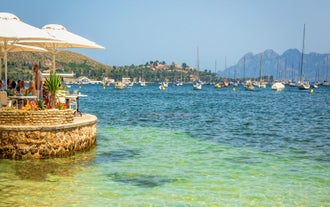Photo of aerial view of the harbour of Port de Pollença, a seaside village located on the northern coast of Mallorca in the Balearic Islands, Spain.