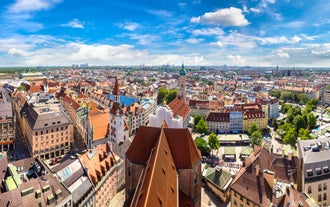 Photo of beautiful postcard view of the famous historic town of Rothenburg ob der Tauber on a sunny day with blue sky and clouds in summer, Franconia, Bavaria, Germany.