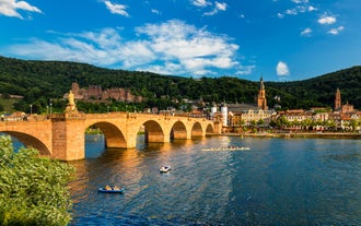 Photo of beautiful postcard view of the famous historic town of Rothenburg ob der Tauber on a sunny day with blue sky and clouds in summer, Franconia, Bavaria, Germany.