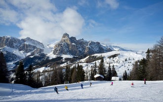 photo of Autumn morning panoramic shot on Stern-La Villa from San Cassiano, Piz la Ila, Gruppo Sella, Sassongher, Piza de Gherdenacia, Peitlerkofel in Italy.
