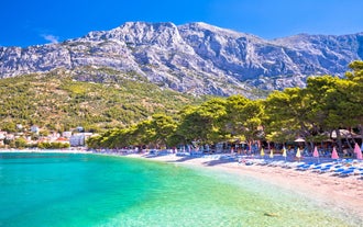Photo of aerial view on Adriatic Sea and Baska Voda place in Makarska Riviera, Dalmatia region, popular tourist summer resort in Croatia.