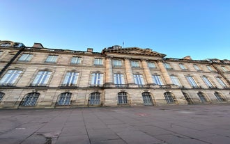 Photo of traditional half-timbered houses on picturesque canals in La Petite France in the medieval fairytale town of Strasbourg, France.
