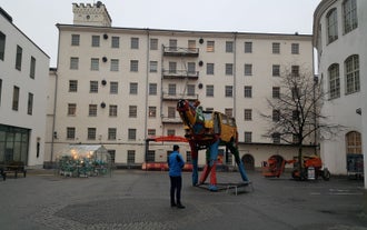 Aerial view of the Tampere city at sunset. Tampella building. View over Tammerkoski river in warm sunlight.