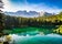 Sunny morning in Lake Carezza / Lago di Carezza / Karersee in Dolomites (Dolomiti), South Tyrol, Italy.