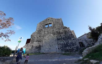 photo of aerial panoramic view of beautiful town of Lovran and sea walkway in Croatia.