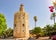 Photo of Tower of Gold (Torre del Oro) on Guadalquivir river embankment, Spain .