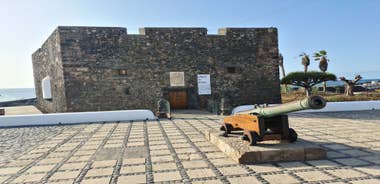 Photo of aerial view with Puerto de la Cruz, in background Teide volcano, Tenerife island, Spain.