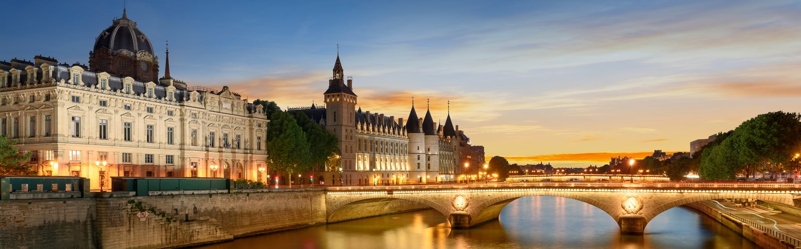 Photo of Consiergerie, Pont Neuf and Seine river at sunny summer sunset, Paris, France