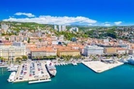 photo of aerial panoramic view of beautiful town of Lovran and sea walkway in Croatia.