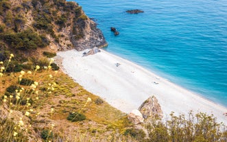 Photo of an aerial view of a mediterranean spanish beach (San Cristobal beach) at Almunecar, Granada, Spain.