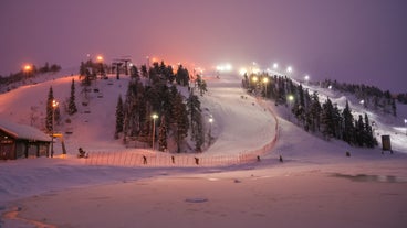 photo of beautiful view of Finnish landscape with trees in snow, ruka, karelia, lapland, hilly winter landscapes in famous winter sports area called Ruka.