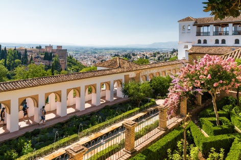 Photo of Sunny view of Granada from viewpoint of Palacio de Generalife, Andalusia province, Spain.