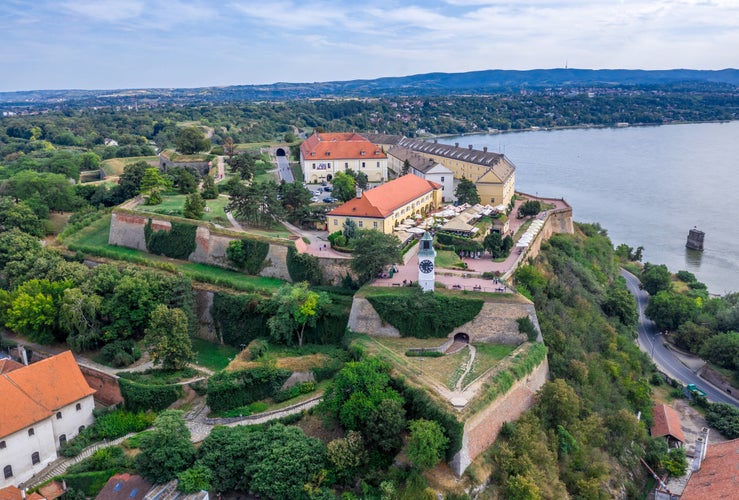 Aerial panoramic view of Petrovaradin fortress trdava above the Danube River across from Novi Sad Serbia with beautiful blue sk