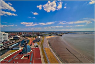 Photo of aerial view of the city of Bremerhaven with the harbor and traditional sailing-ships, Germany.