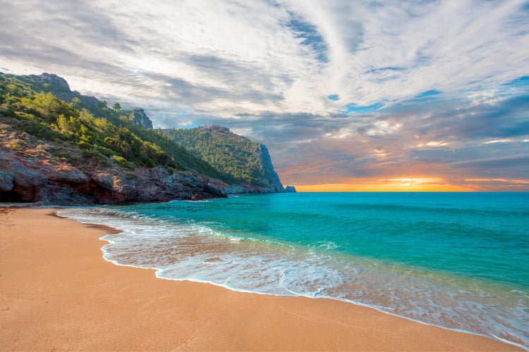 Photo of Beach of Cleopatra with sea and rocks ,Antalya, Turkey.