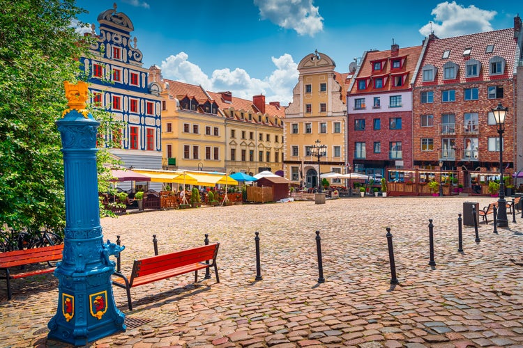 Photo of traditional blue water pump with gryphon head crest from Szczecin, Poland.