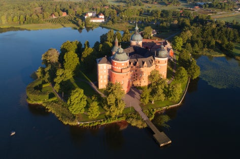 photo of aerial view of the Swedish Gripsholm castle located in Mariefred during the morning in the summer in Sweden.