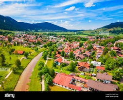 photo of Unterammergau town in beautiful autumnal nature and blue sky with clouds in Bavaria, Germany.