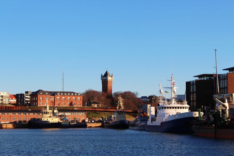 PHOTO OF VIEW OF View to the harbour of Esbjerg, historical water tower in the background, Jutland, Denmark.