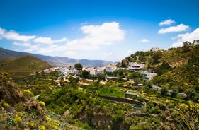 photo of landscape with Maspalomas town and golden sand dunes at sunrise, Gran Canaria, Canary Islands, Spain.