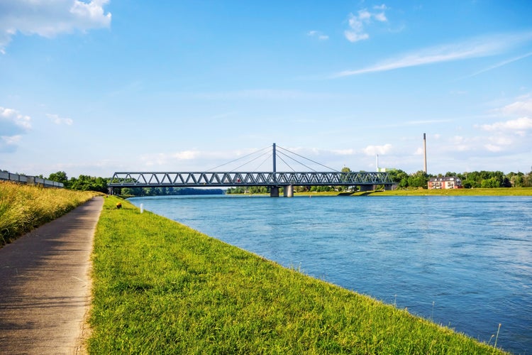 Photo of Rhine bridge in Karlsruhe, view from river rhine bikeway riversides.