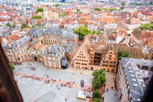 Photo of traditional half-timbered houses on picturesque canals in La Petite France in the medieval fairytale town of Strasbourg, France.