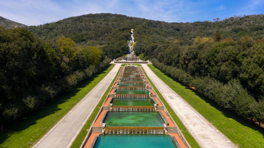 Photo of aerial view of the Fountain of Venus and Adonis and waterfall in the Royal Palace of Caserta also known as Reggia di Caserta, Italy.