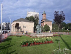 Photo of Water fountain in central square in Iasi town, Cultural Palace in background, Moldavia, Romania.