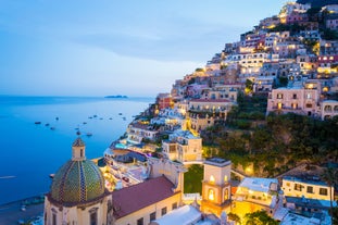 photo of an aerial view of Parghelia in Italy. Overview of seabed seen from above, transparent water and beach with umbrellas.