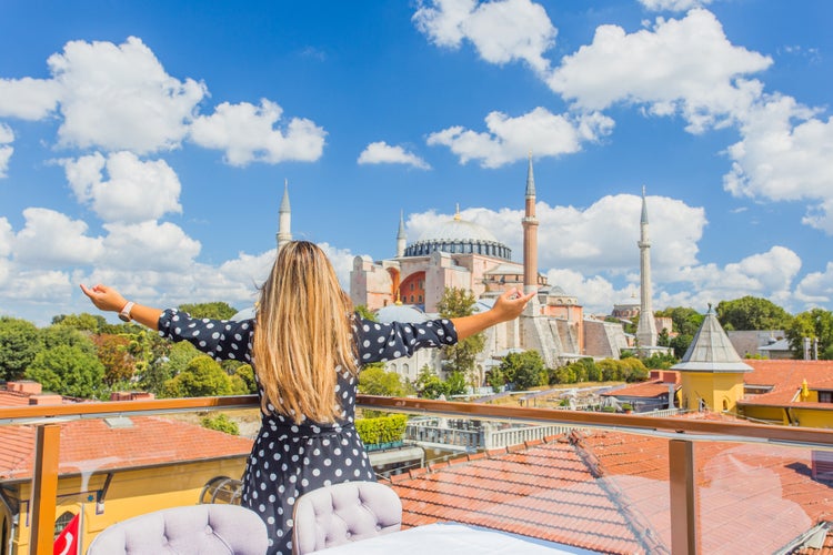 Photo of tourist and wonderful panoramic view of the Istanbul city against the beautiful sky, Turkey.