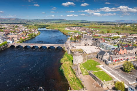 photo  of view  of  13th century King Johns Castle in Limerick by the Shannon river, Ireland