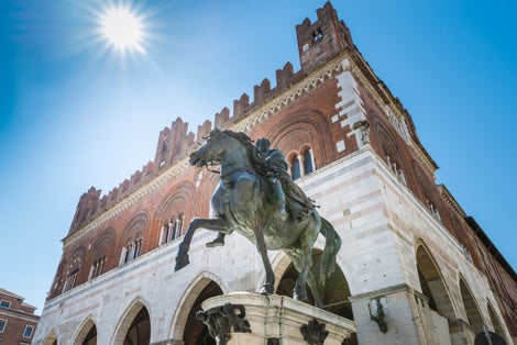Photo of Piazza Cavalli (Square horses), equestrian monument at Ranuccio I Farnese (XVII century), in the background the palazzo Gotico (Gothic palace) in the city center, Piacenza, medieval town, Italy.
