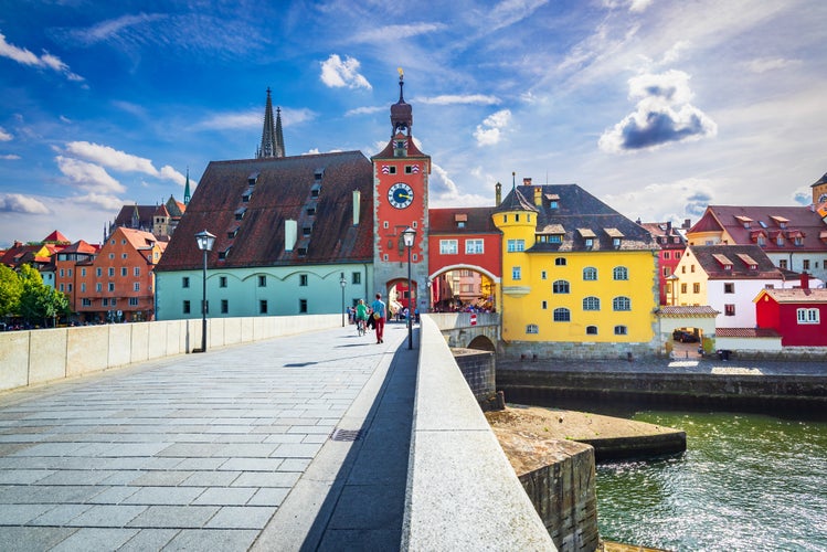 Regensburg, Germany, historical Stone Bridge, Bridge tower and buildings, Danube River.