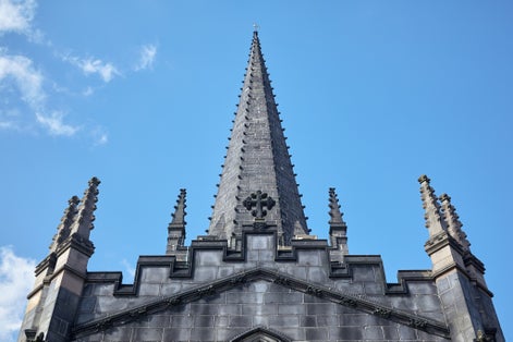 Photo of the Sheffield Cathedral roof with the pinnacles and the high spire, England.