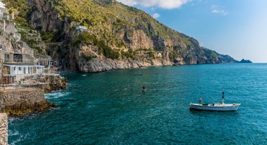 Photo of aerial morning view of Amalfi cityscape on coast line of Mediterranean sea, Italy.